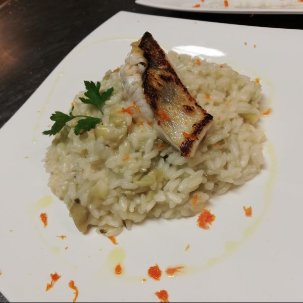 Risotto ai carciofi luccio perca scottato e zeste di arancia