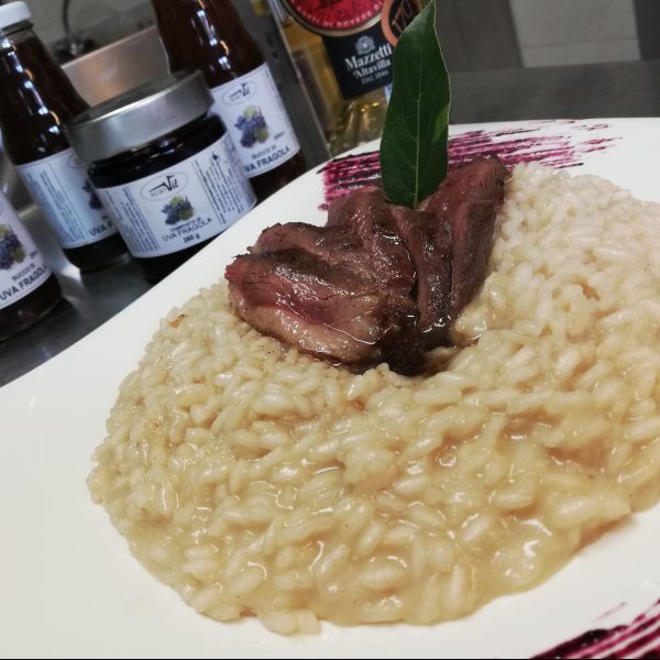 Risotto all'uva fragola con Petto d'anatra sfumato al brandy Mazzetti